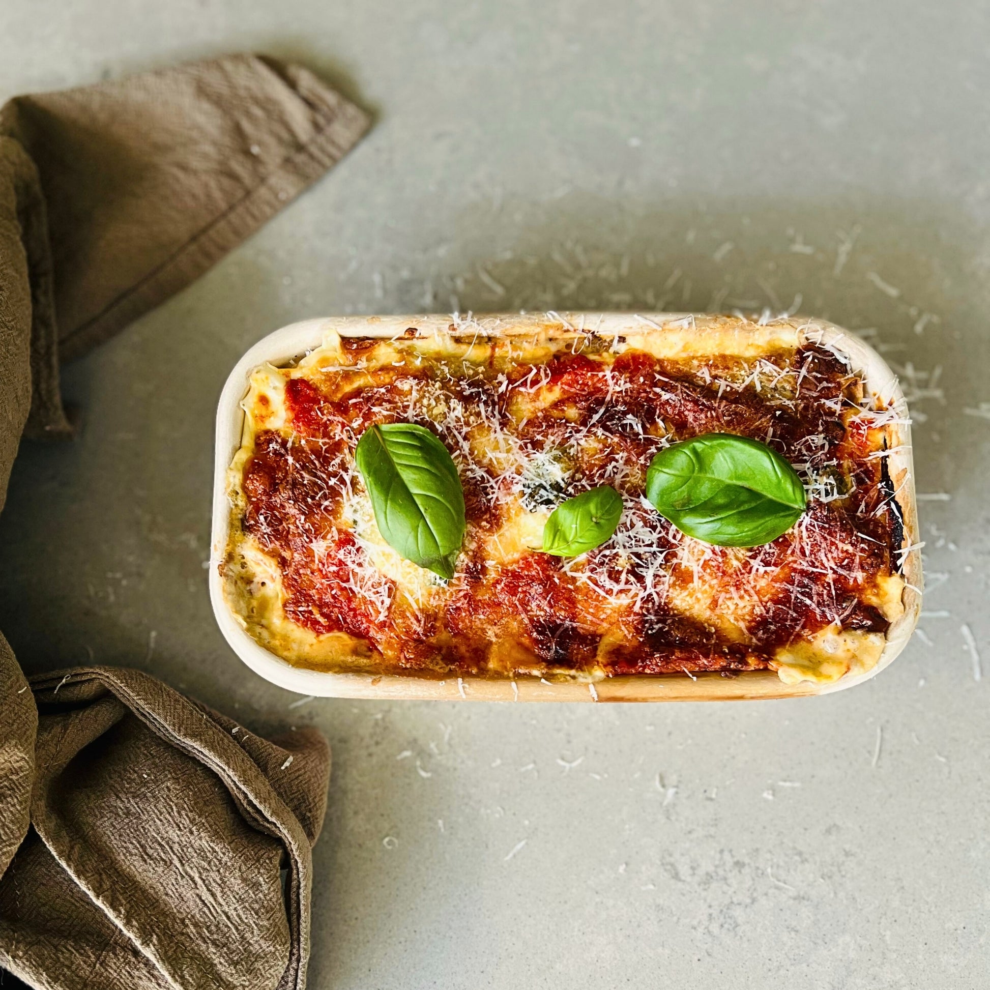 Spinach and ricotta crespelle baked in tomato sauce – Italian meal delivery Northern Rivers